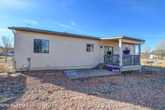 back of property featuring a patio area