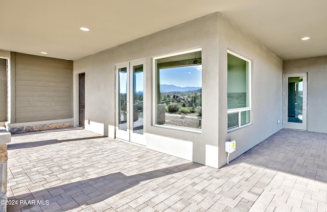 view of patio / terrace featuring a mountain view