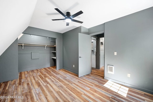 unfurnished bedroom with ceiling fan and light hardwood / wood-style floors