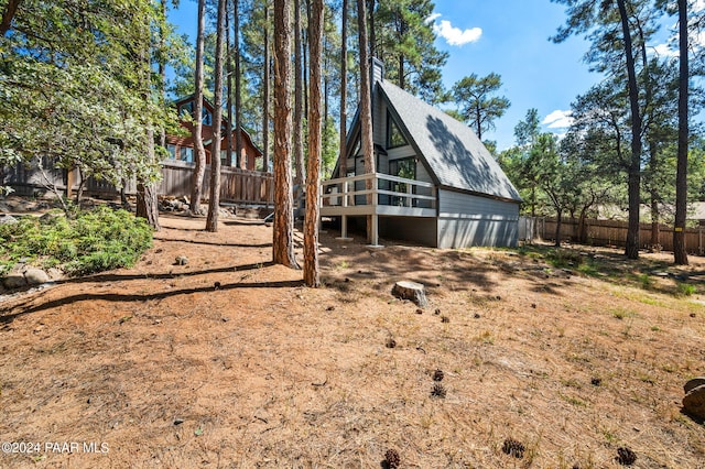 back of house featuring a deck