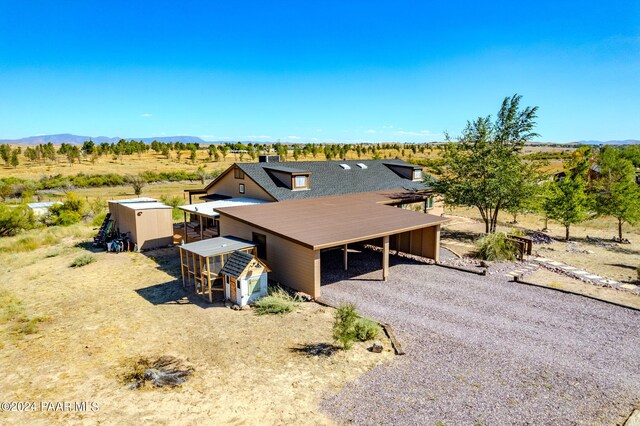 drone / aerial view with a mountain view and a rural view