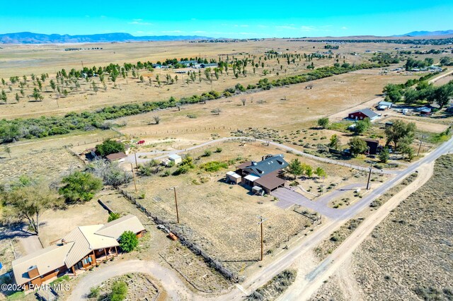 birds eye view of property with a mountain view and a rural view