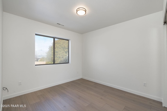 unfurnished room featuring light wood-type flooring