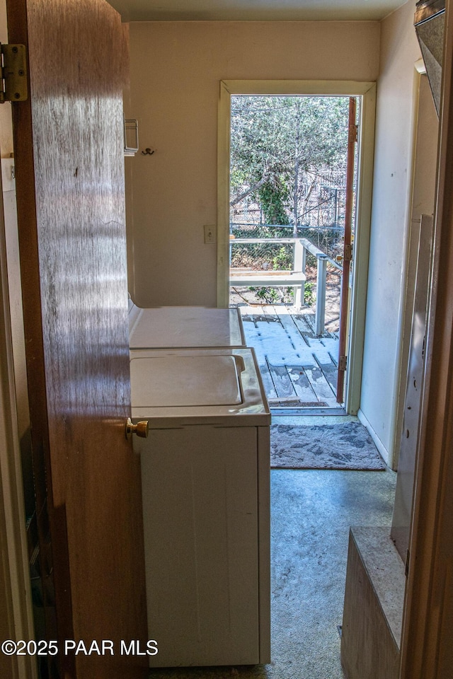 washroom featuring washing machine and dryer and carpet