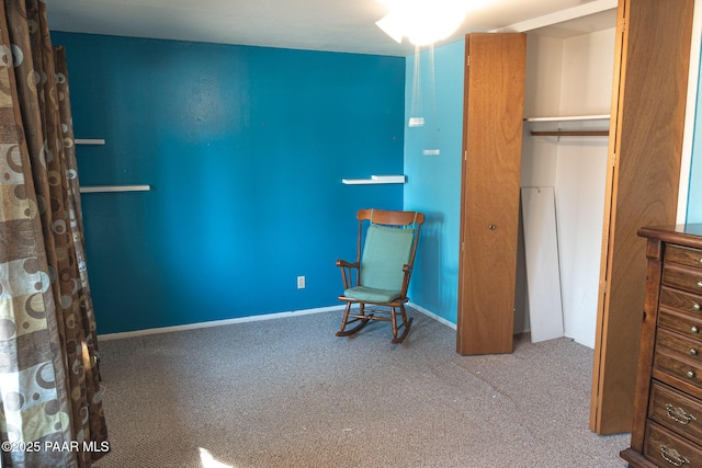 unfurnished bedroom featuring carpet, a closet, and baseboards