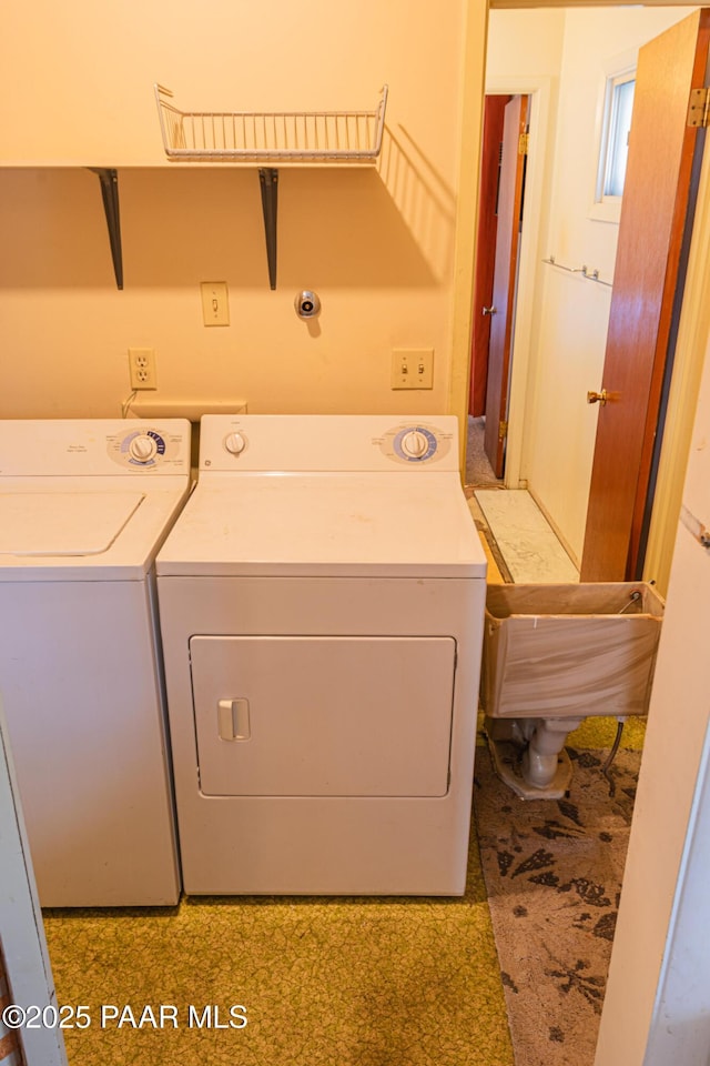 washroom featuring laundry area and washer and dryer