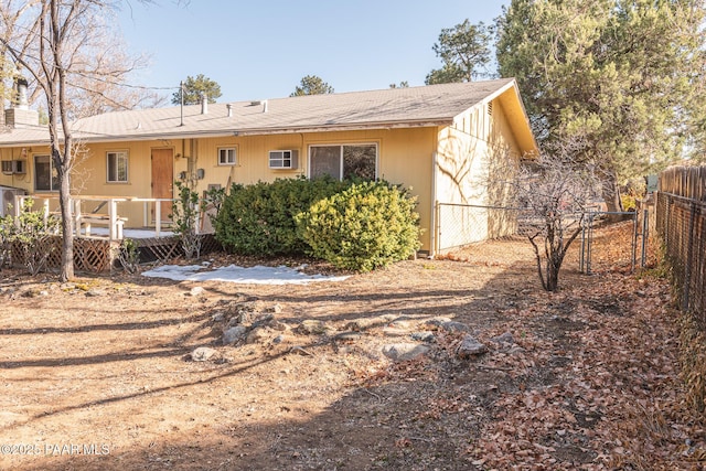 back of property with fence