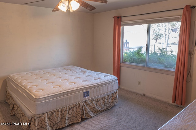 bedroom with a ceiling fan and carpet flooring