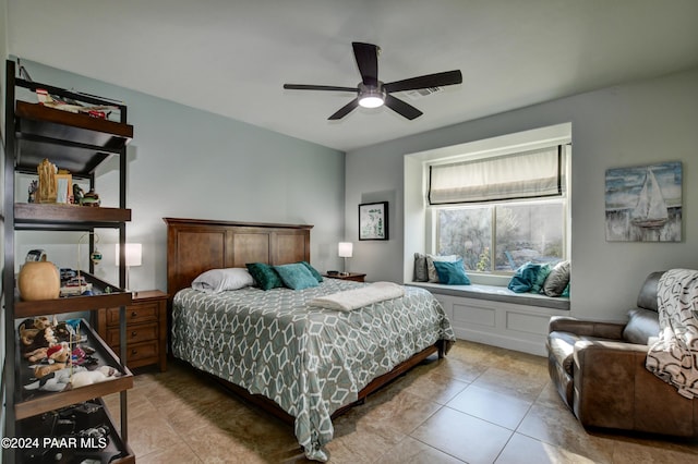 tiled bedroom with ceiling fan