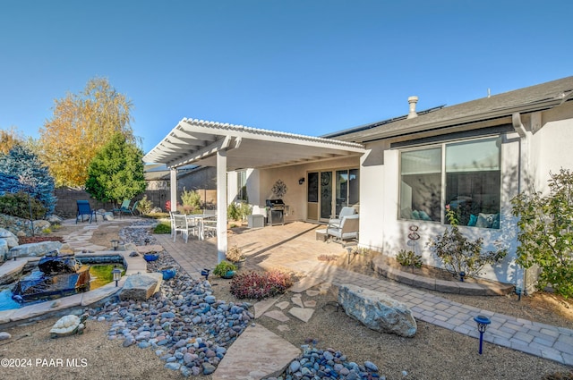 back of house with a patio