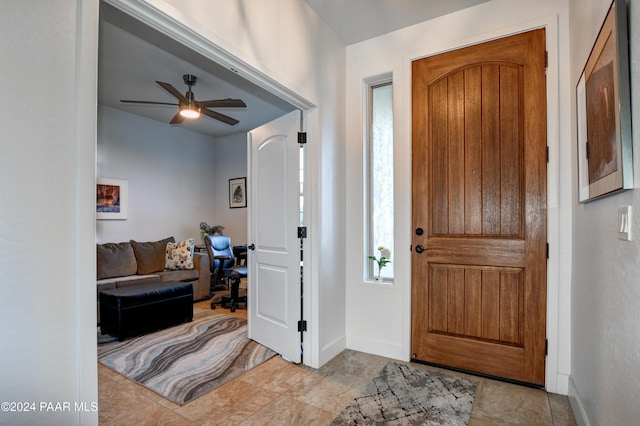 foyer featuring ceiling fan