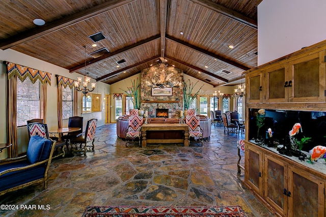 bedroom with an inviting chandelier, a fireplace, high vaulted ceiling, and multiple windows