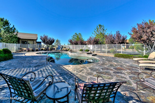 view of pool featuring a patio area