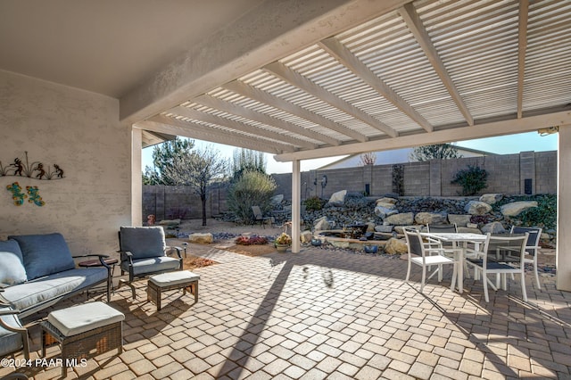 view of patio featuring an outdoor hangout area and a pergola