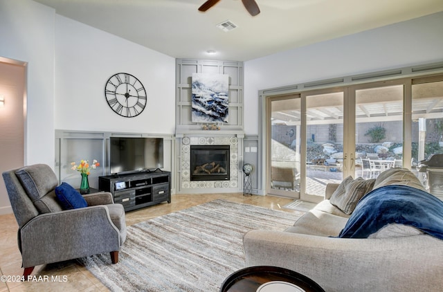 living room with light tile patterned floors and ceiling fan