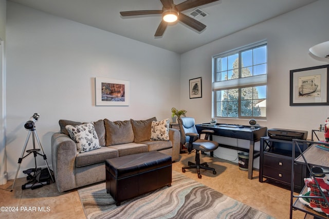 home office with ceiling fan and light tile patterned floors