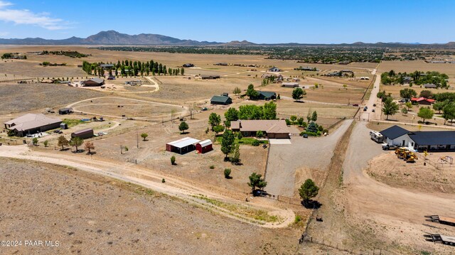 aerial view with a mountain view and a rural view