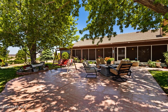 view of patio with a sunroom and an outdoor hangout area