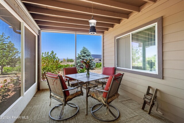 sunroom / solarium with beam ceiling