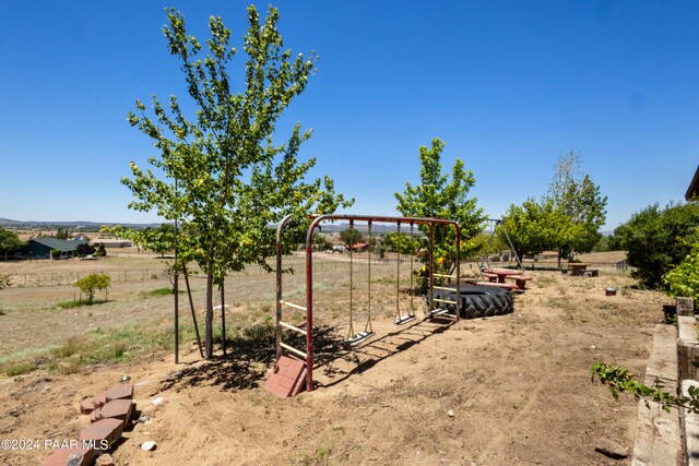 view of yard with a rural view