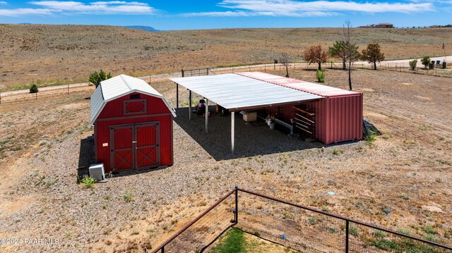 view of outdoor structure featuring a rural view