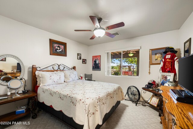 bedroom featuring ceiling fan and light colored carpet