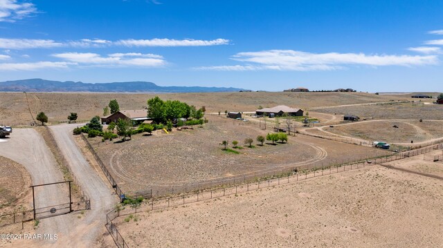 birds eye view of property with a mountain view and a rural view