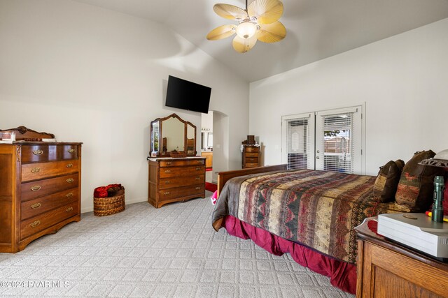 bedroom featuring light colored carpet, ceiling fan, access to exterior, and lofted ceiling