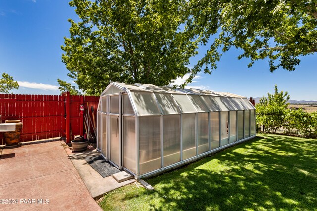 view of outbuilding featuring a yard