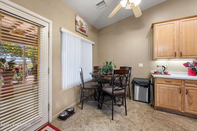 dining room featuring ceiling fan