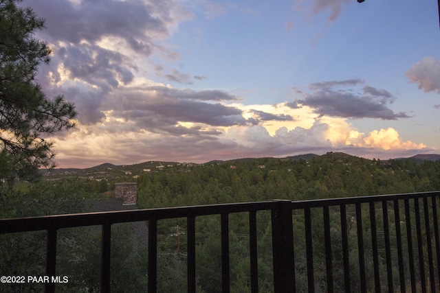 view of mountain feature with a view of trees