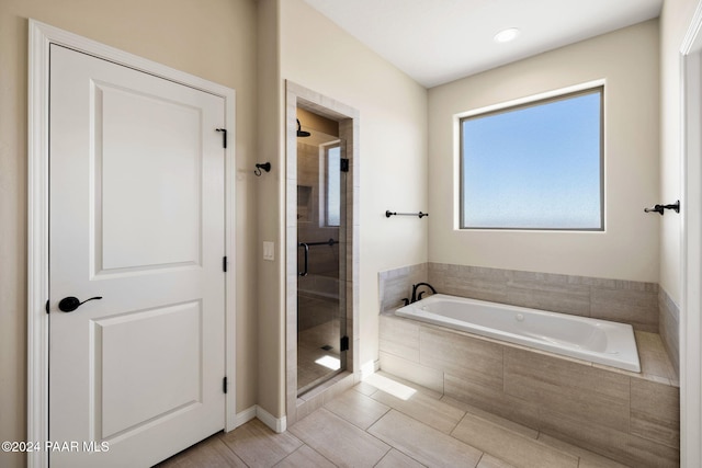 bathroom with independent shower and bath