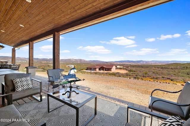 view of patio / terrace featuring outdoor lounge area and a mountain view