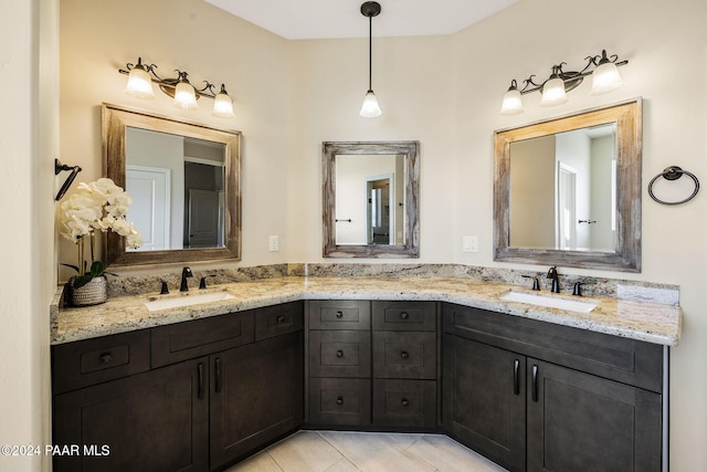 bathroom featuring tile patterned flooring and vanity