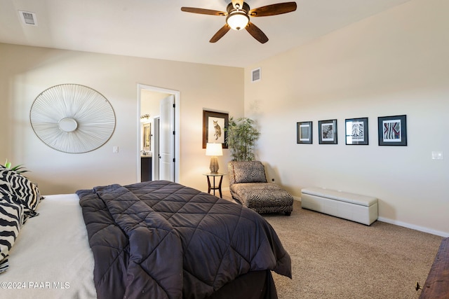 bedroom featuring ensuite bath, ceiling fan, carpet, and lofted ceiling