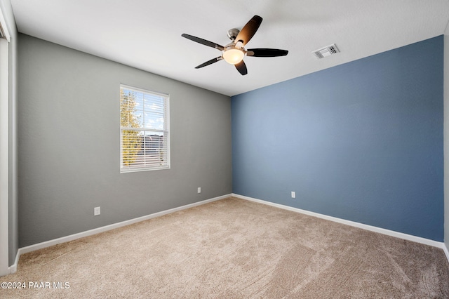 carpeted empty room with ceiling fan