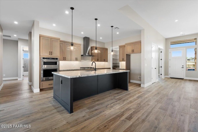 1052 N Cloud Cliff Pass, Prescott Valley, AZ 86314 - kitchen with wall chimney exhaust hood, stainless steel double oven, a sink, light wood-style flooring, and recessed lighting