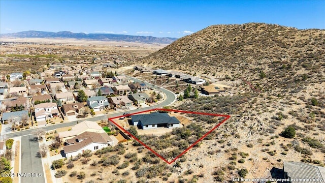 1052 N Cloud Cliff Pass, Prescott Valley, AZ 86314 - aerial view of residential area featuring mountains, property boundaries highlighted, and a desert landscape