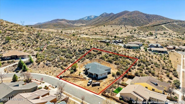 1052 N Cloud Cliff Pass, Prescott Valley, AZ 86314 - aerial perspective of suburban area with mountains, property boundaries highlighted, and a desert landscape