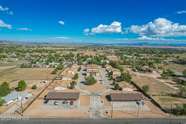 birds eye view of property featuring a mountain view