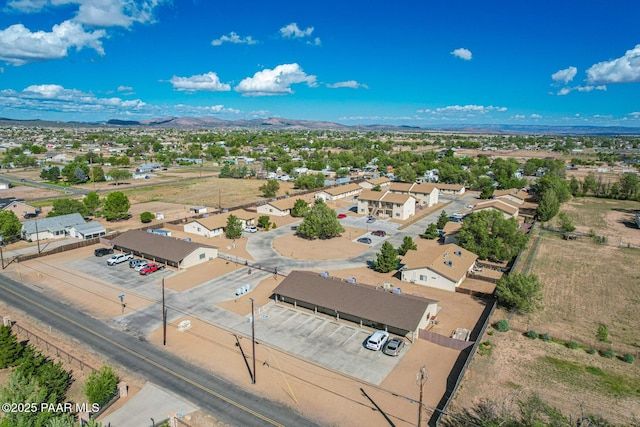 birds eye view of property featuring a mountain view and a residential view