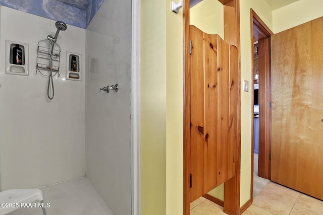 bathroom featuring a shower and tile patterned floors