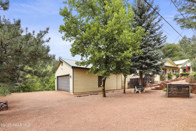 view of front of house featuring an outbuilding and a garage