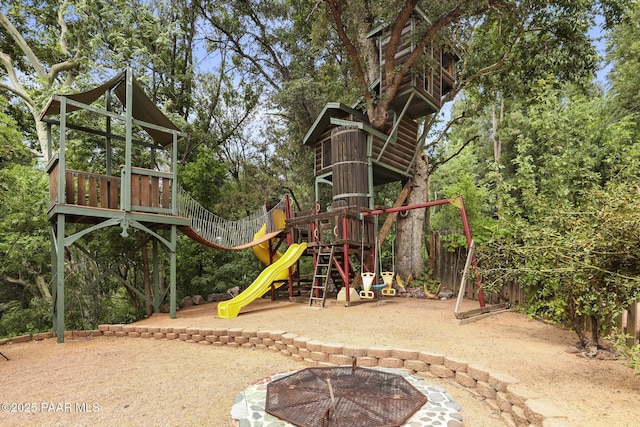 view of playground featuring a fire pit