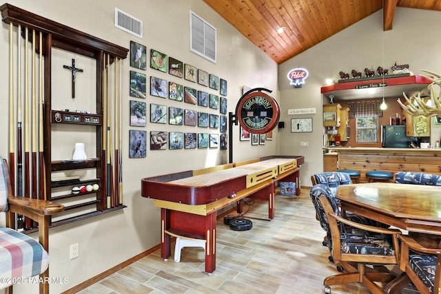 recreation room with lofted ceiling with beams and wooden ceiling