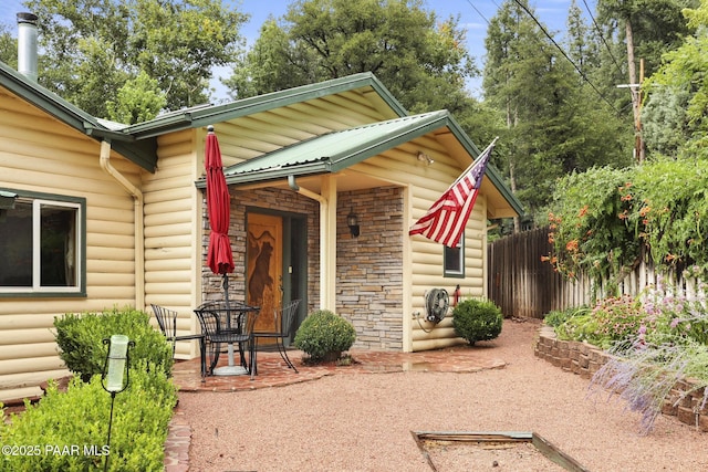 property entrance featuring a patio area