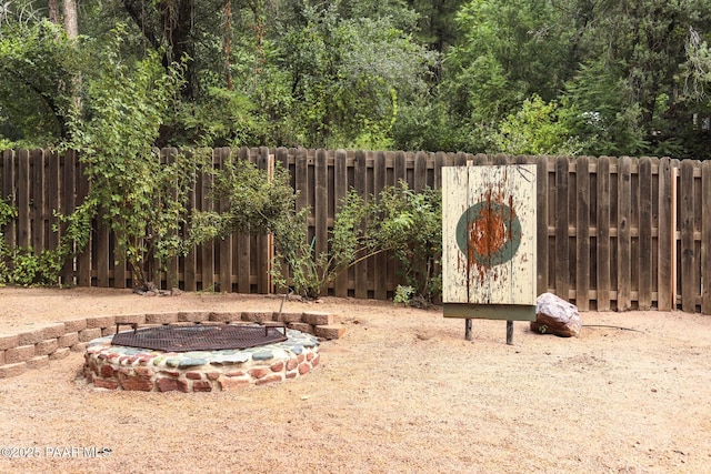 view of yard featuring a fire pit