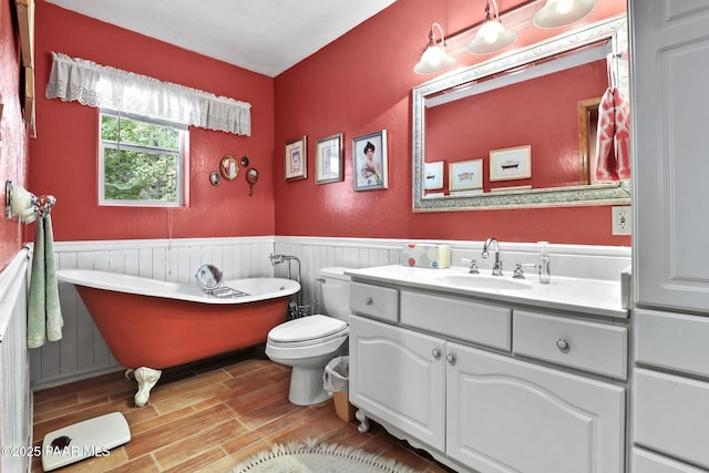 bathroom with vanity, toilet, and a bathtub