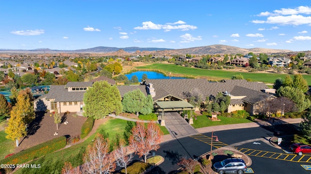 bird's eye view with a residential view and a water and mountain view