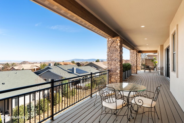 deck featuring a mountain view and a residential view